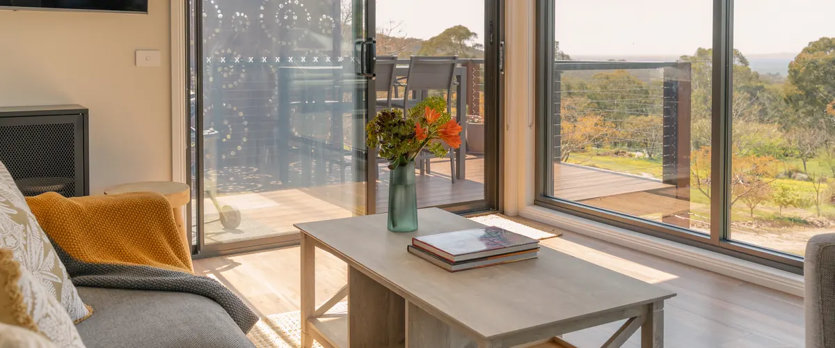 The upstairs lounge, its window wall open to the view