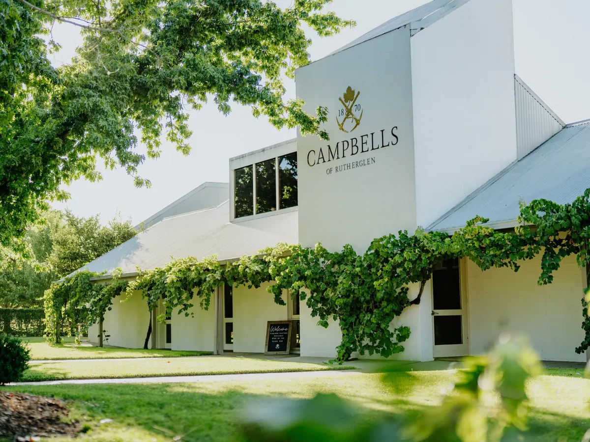 The Campbells winery building at Rutherglen behind its vines